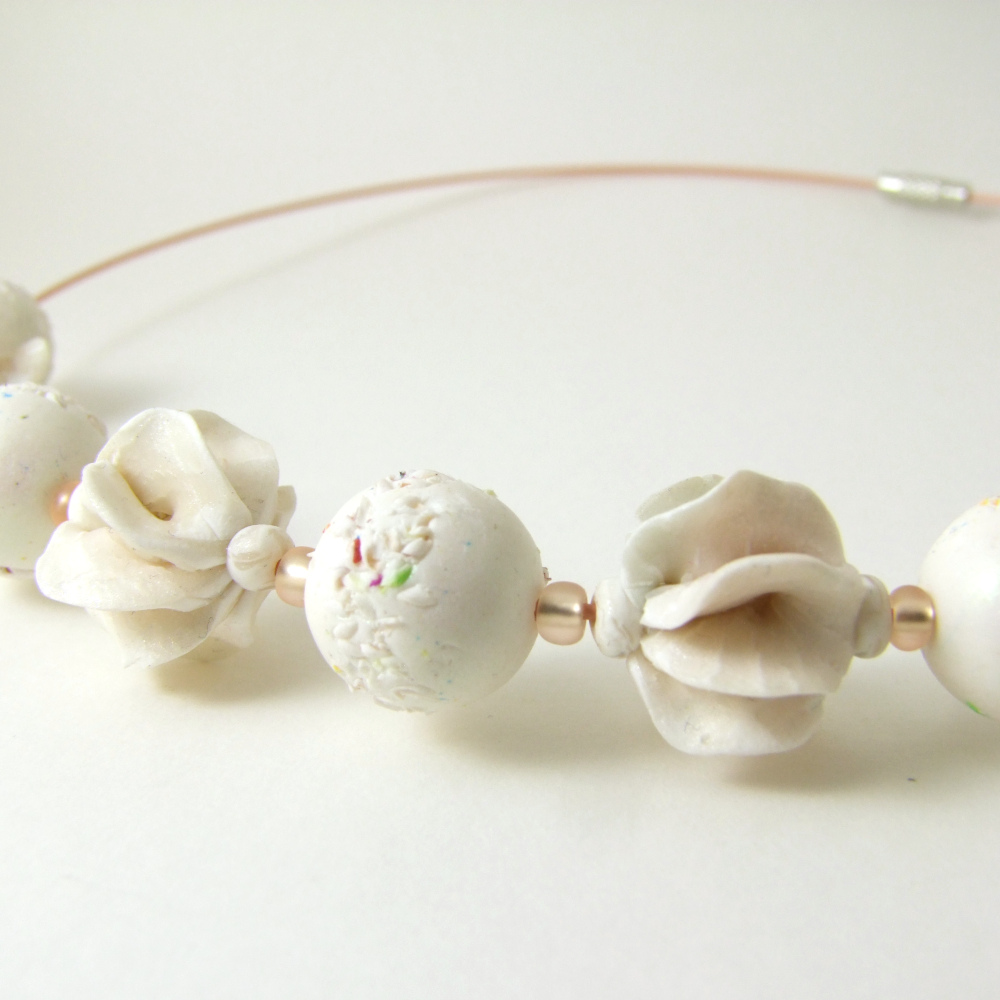 mostly white structural polymer clay beads