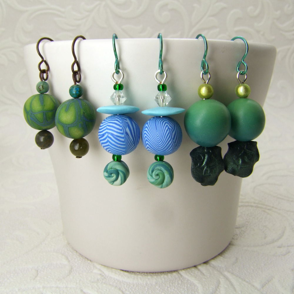 a mix of blue and green earrings