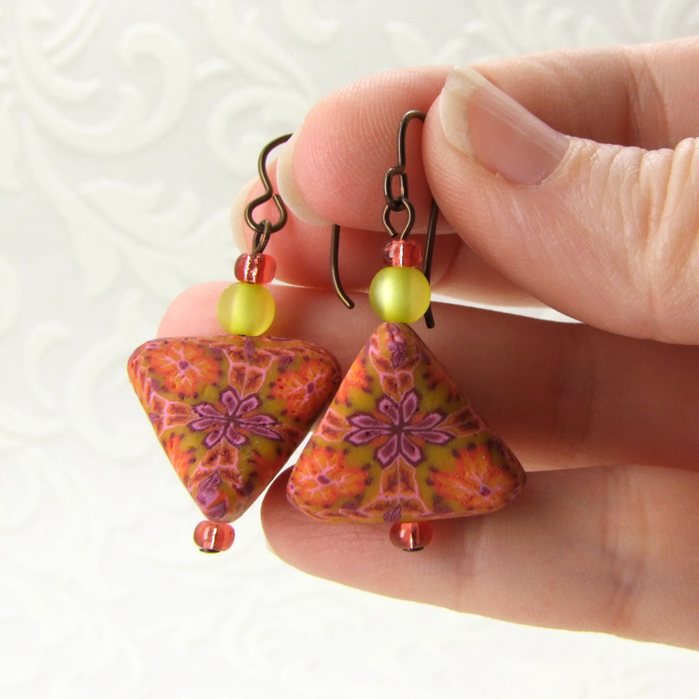 orange tetrahedron shaped earrings